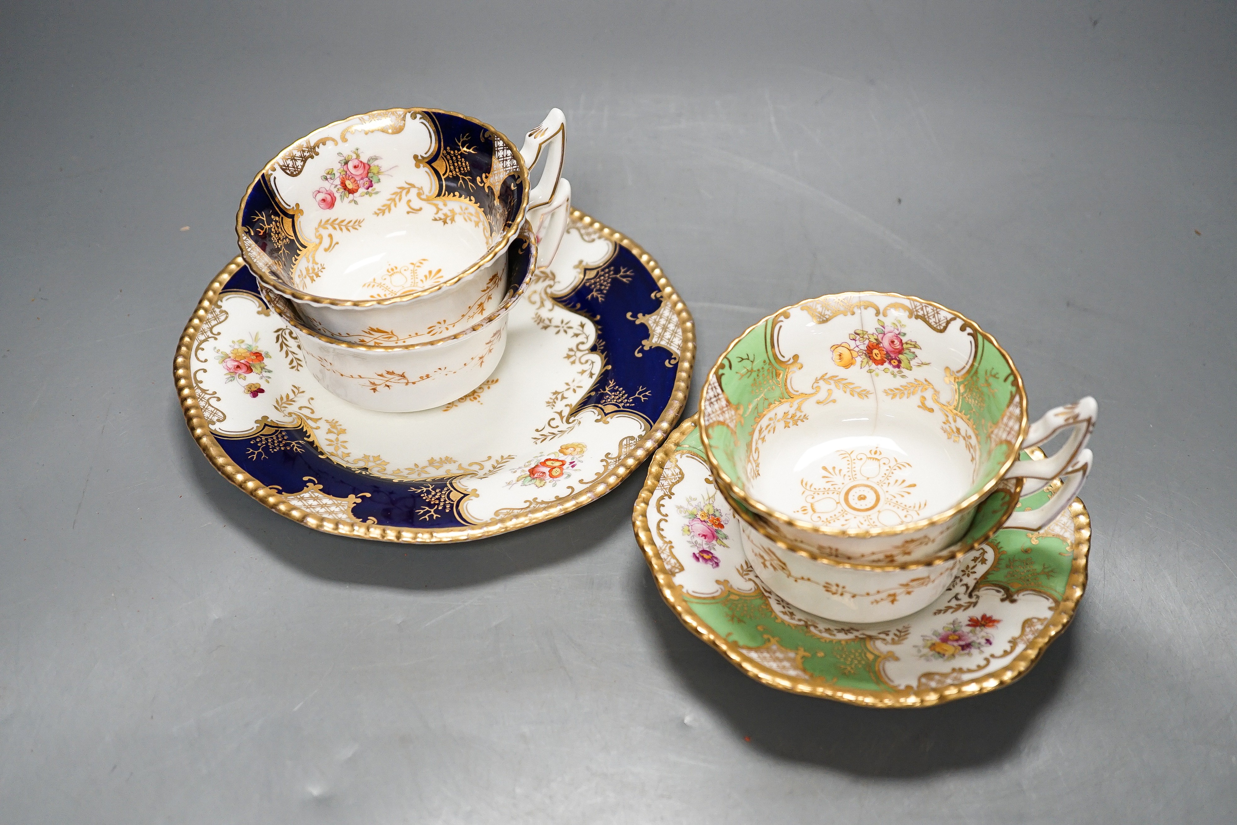 A large set of Coalport blue ground tea and coffee service and similar green ground tea wares